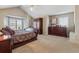 Main bedroom with high ceilings, carpeting, and large windows at 10834 Bobcat Ter, Lone Tree, CO 80124