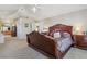 Main bedroom with high ceilings, carpeting, and ensuite bathroom at 10834 Bobcat Ter, Lone Tree, CO 80124