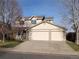 Front view of the two-story house with a two-car garage at 18739 E Linvale Cir, Aurora, CO 80013