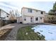 Back exterior view of the two-story house with a small yard at 18739 E Linvale Cir, Aurora, CO 80013