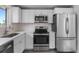 Modern kitchen with stainless steel appliances at 1845 W 46Th Ave, Denver, CO 80211