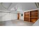 Finished garage with shelving and laundry area at 4885 Silver Spruce Ln, Evergreen, CO 80439