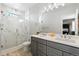 Elegant bathroom with double vanity, marble shower, and modern fixtures at 12273 Karls Ln, Northglenn, CO 80241