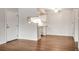 Bright dining area with hardwood floors and kitchen access at 8335 Fairmount Dr # 9-206, Denver, CO 80247