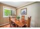 Charming dining room with a rustic wooden table and four chairs at 8314 S Everett Way # B, Littleton, CO 80128