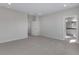 Spacious bedroom with carpeting and access to a bathroom at 13502 E 100Th Ave, Commerce City, CO 80022