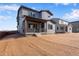 Two-story house with gray siding and landscaping at 13502 E 100Th Ave, Commerce City, CO 80022