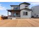 Two-story house with gray siding and landscaping at 13502 E 100Th Ave, Commerce City, CO 80022