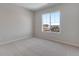 Cozy bedroom with carpet and a window offering views of the neighborhood at 13502 E 100Th Ave, Commerce City, CO 80022