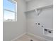 Laundry room with built-in shelving and plenty of light at 13502 E 100Th Ave, Commerce City, CO 80022