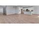 Open living space with hardwood floors and an adjacent kitchen at 13502 E 100Th Ave, Commerce City, CO 80022