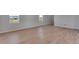 Open living room with hardwood floors and ample natural light at 13502 E 100Th Ave, Commerce City, CO 80022
