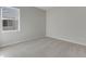 Bright bedroom featuring carpet and a window with neighborhood views at 13502 E 100Th Ave, Commerce City, CO 80022