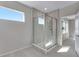 Clean bathroom with a glass shower enclosure and tile flooring at 13502 E 100Th Ave, Commerce City, CO 80022