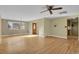 Spacious living room with hardwood floors and adjacent dining area at 1760 S Uinta Way, Denver, CO 80231