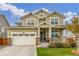 Two-story house with a two-car garage and landscaping at 16395 Milwaukee St, Thornton, CO 80602