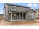 Two-story house with gray siding and a covered patio at 3827 N Elk St, Aurora, CO 80019