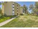 Building exterior with walkway and grassy area at 585 S Alton Way # 2C, Denver, CO 80247