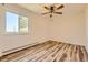 Bedroom with ceiling fan and wood-look floors at 585 S Alton Way # 2C, Denver, CO 80247