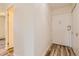 Simple hallway with light walls and wood flooring at 585 S Alton Way # 2C, Denver, CO 80247
