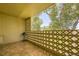 Private balcony with tiled floor and lattice walls at 585 S Alton Way # 2C, Denver, CO 80247