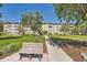 Building exterior with walkway and seating area at 585 S Alton Way # 2C, Denver, CO 80247
