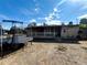 Backyard view showing a shed, trampoline, and patio at 8303 Acoma Way, Denver, CO 80221