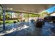 Covered patio with seating area and view of the backyard at 693 S Flamingo Ct, Denver, CO 80246