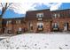 Inviting two-story brick home with a snowy front yard and charming curb appeal at 5747 S Lowell Blvd, Littleton, CO 80123