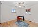 Versatile bedroom with wood floors and workspace setup at 4482 E Utah Pl, Denver, CO 80222