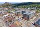 Aerial view of a modern apartment building in an urban setting with mountain views at 20 Wilcox St # 621, Castle Rock, CO 80104