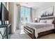 Bright bedroom with large window and wood platform bed at 20 Wilcox St # 621, Castle Rock, CO 80104