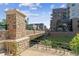 Stone bridge over a creek, with modern buildings in the background at 20 Wilcox St # 621, Castle Rock, CO 80104