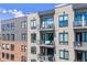 Modern apartment building exterior with balconies and brick details at 20 Wilcox St # 621, Castle Rock, CO 80104