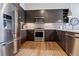 Modern kitchen with stainless steel appliances and dark wood cabinetry at 20 Wilcox St # 621, Castle Rock, CO 80104