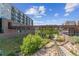 A paved walkway alongside a creek, with apartment buildings nearby at 20 Wilcox St # 621, Castle Rock, CO 80104