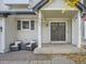 Inviting front porch with double doors and seating area at 5455 S Zang St, Littleton, CO 80127