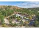 Castle-style home nestled on a hillside with a large driveway at 5380 N Lariat Dr, Castle Rock, CO 80108