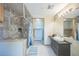 Main bathroom with walk-in shower, linen closet, and modern vanity at 5380 N Lariat Dr, Castle Rock, CO 80108