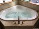 Corner jacuzzi bathtub in spacious bathroom at 5380 N Lariat Dr, Castle Rock, CO 80108