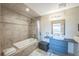 Bathroom with soaking tub, shower, and modern vanity at 5380 N Lariat Dr, Castle Rock, CO 80108