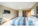 Bedroom with a queen bed and access to a bathroom at 5380 N Lariat Dr, Castle Rock, CO 80108