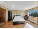 Comfortable bedroom with hardwood floors, large window and built-in wardrobe at 5380 N Lariat Dr, Castle Rock, CO 80108
