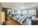 Spacious bedroom with wood floors and large windows offering natural light at 5380 N Lariat Dr, Castle Rock, CO 80108