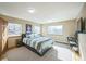 Bedroom with a queen bed and adjacent work area at 5380 N Lariat Dr, Castle Rock, CO 80108