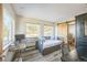Bedroom with daybed, home office, and views of backyard at 5380 N Lariat Dr, Castle Rock, CO 80108