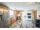 Modern kitchen with stainless steel appliances and wood cabinets at 5380 N Lariat Dr, Castle Rock, CO 80108