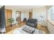 Living area with hardwood floors, comfortable seating, and access to bathroom at 5380 N Lariat Dr, Castle Rock, CO 80108