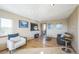 Bright living room with hardwood floors, fireplace, and ample natural light at 5380 N Lariat Dr, Castle Rock, CO 80108