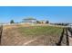 Large backyard with open space and a view of the house at 9508 E 147Th Ave, Brighton, CO 80602